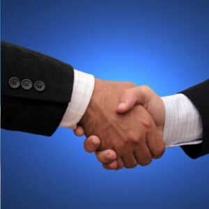 Two people shaking hands, symbolizing confidence and success in a job interview.