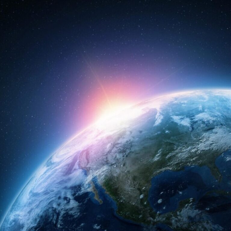 Earth globe viewed from above with the sun rising, symbolizing perspective, renewal, and new beginnings.