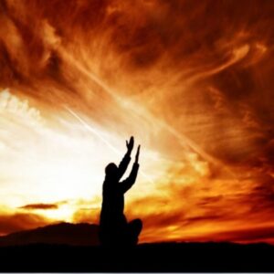 Man kneeling with hands raised to the sky, expressing deep emotional pain and longing for relief