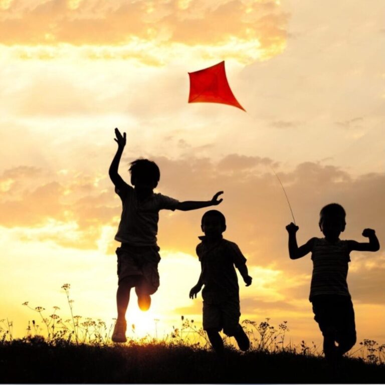 Children playing joyfully, symbolizing innocence, freedom, and inner child healing