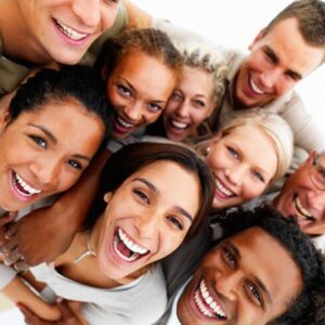 Group of people smiling confidently, representing high self-esteem and confidence.