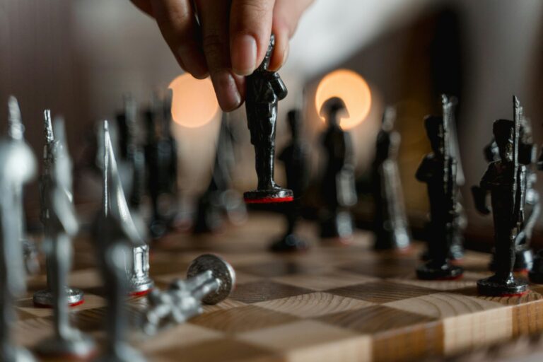 Chessboard with pieces arranged mid-game, symbolizing strategy, focus, and memory.