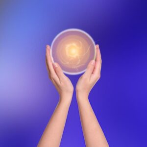A hand holding a glowing aura representing boosted energy, vitality, and inner strength through hypnosis.