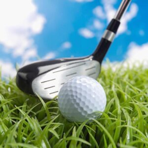 A close-up of a golf ball resting on the green, ready for a perfect shot.