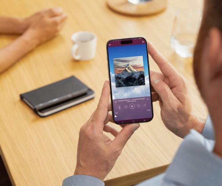 A smartphone displaying a calm meditation app screen, symbolizing relaxation, mindfulness, and digital wellness