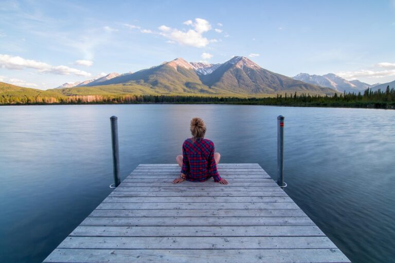A close-up of a person’s peaceful expression while listening, symbolizing trust, relaxation, and mindfulness during meditation or therapy