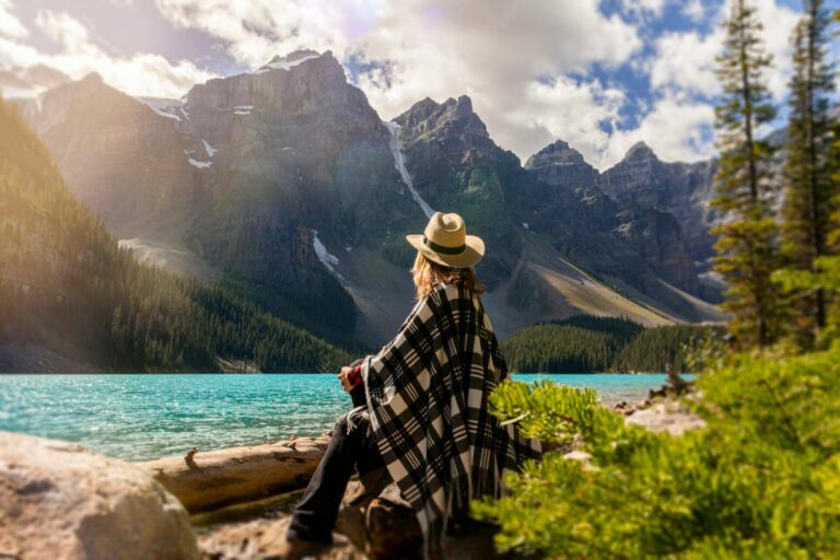 Portrait of a person sitting or standing calmly, eyes closed, practicing mindfulness and relaxation.
