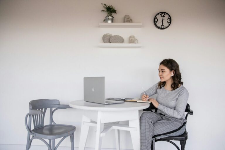 A student studying calmly at a desk, symbolizing concentration, relaxation, and mental clarity supported by hypnotherapy.
