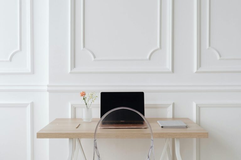 A clean, minimal desk with sunlight streaming in, symbolizing focus, clarity, and peace of mind.
