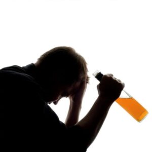 A person refusing a glass of alcohol, symbolizing control and freedom from drinking habits.