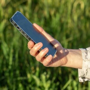 A person putting their phone down, symbolizing control over screen addiction and reclaiming focus.