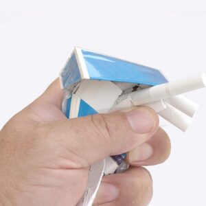 A person breaking a cigarette, symbolizing freedom from smoking addiction.