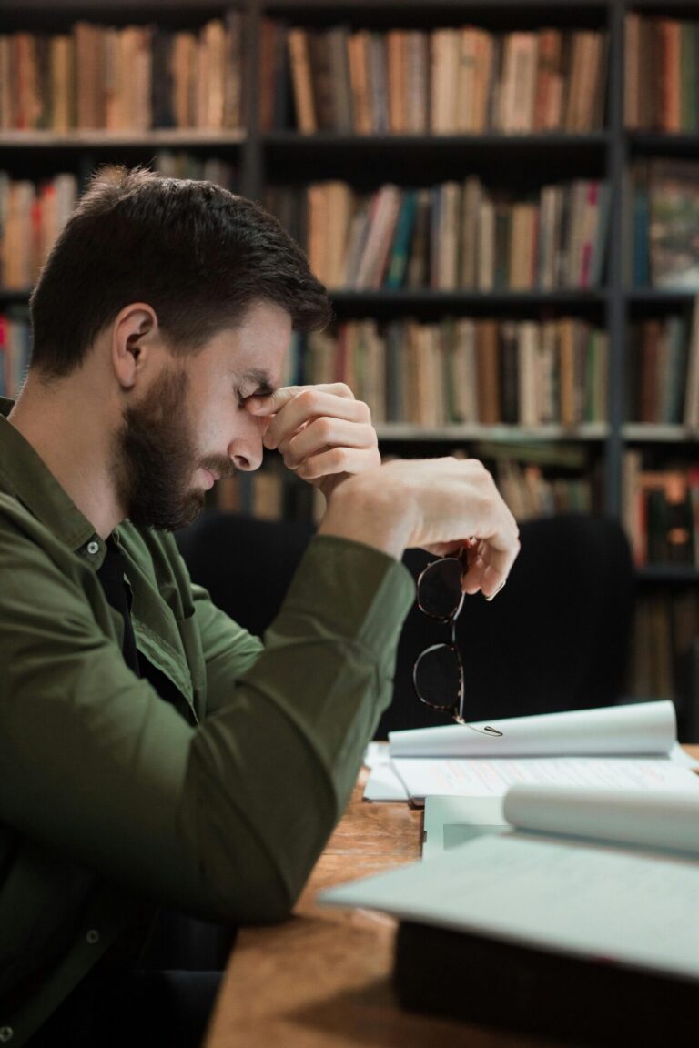 Stressed person sitting in front of a computer