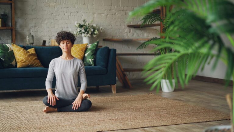 Person practicing breathing exercise for emotional regulation and calmness