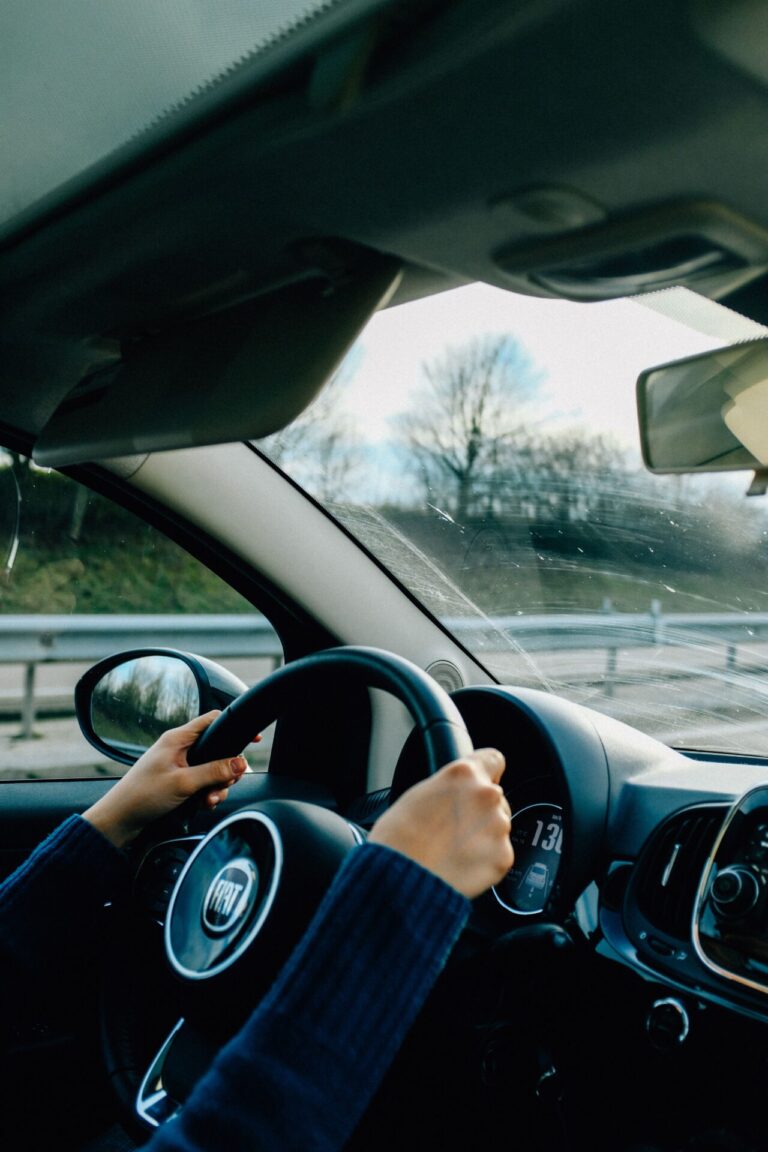 Woman driving calmly with confidence after overcoming driving anxiety