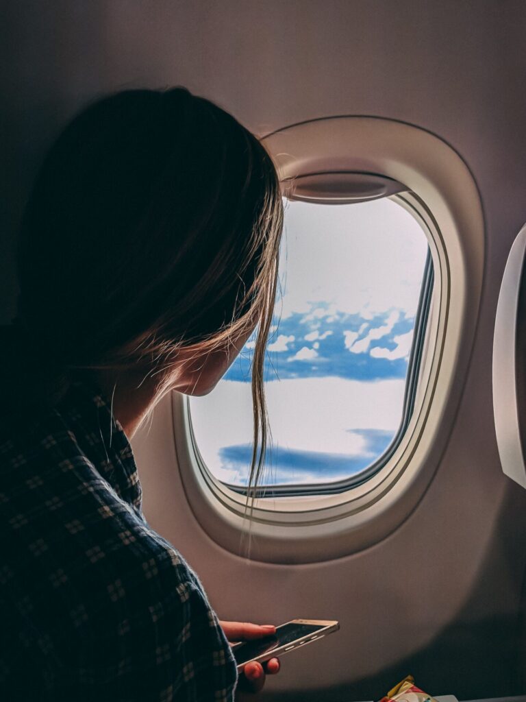 Relaxed passenger sitting comfortably on an airplane during a flight