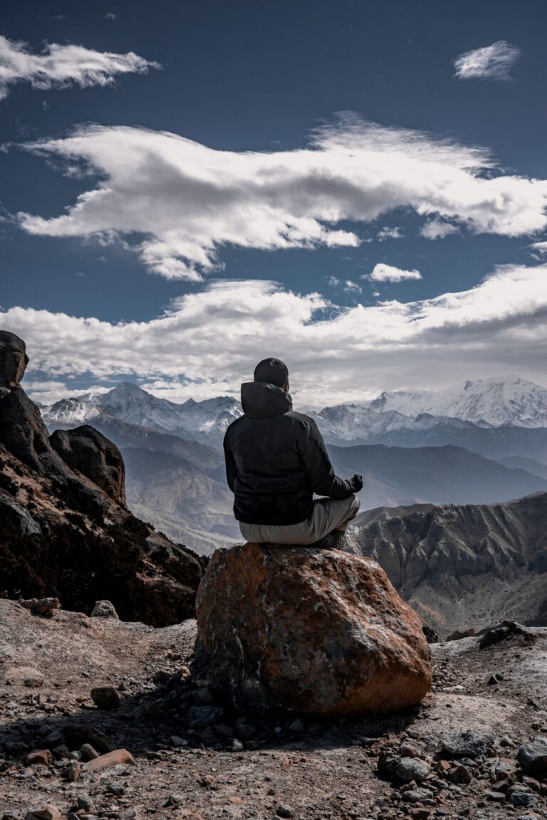 Person practicing meditation in a calm and peaceful setting
