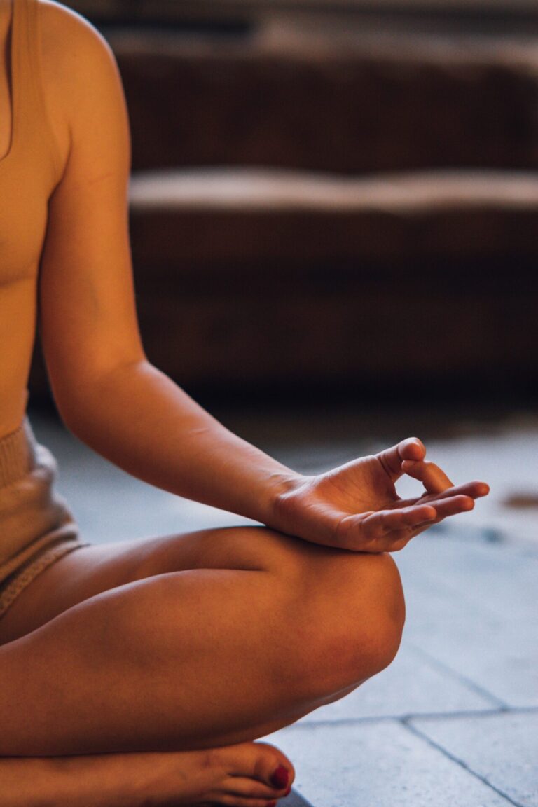 Person practicing relaxation during a professional hypnotherapy session