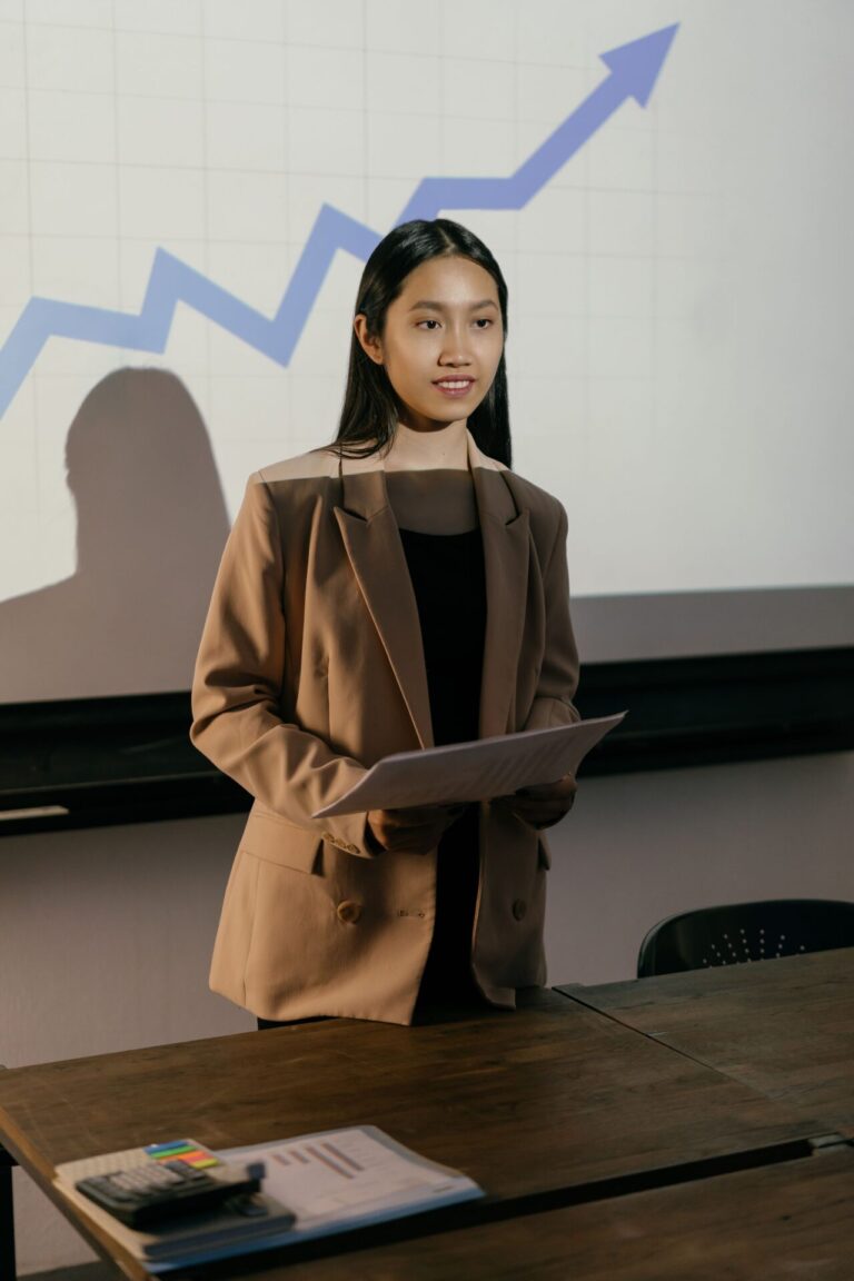 Young woman confidently speaking in front of an audience