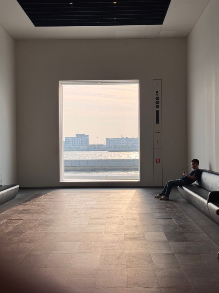 Person sitting peacefully in a calm and cozy room